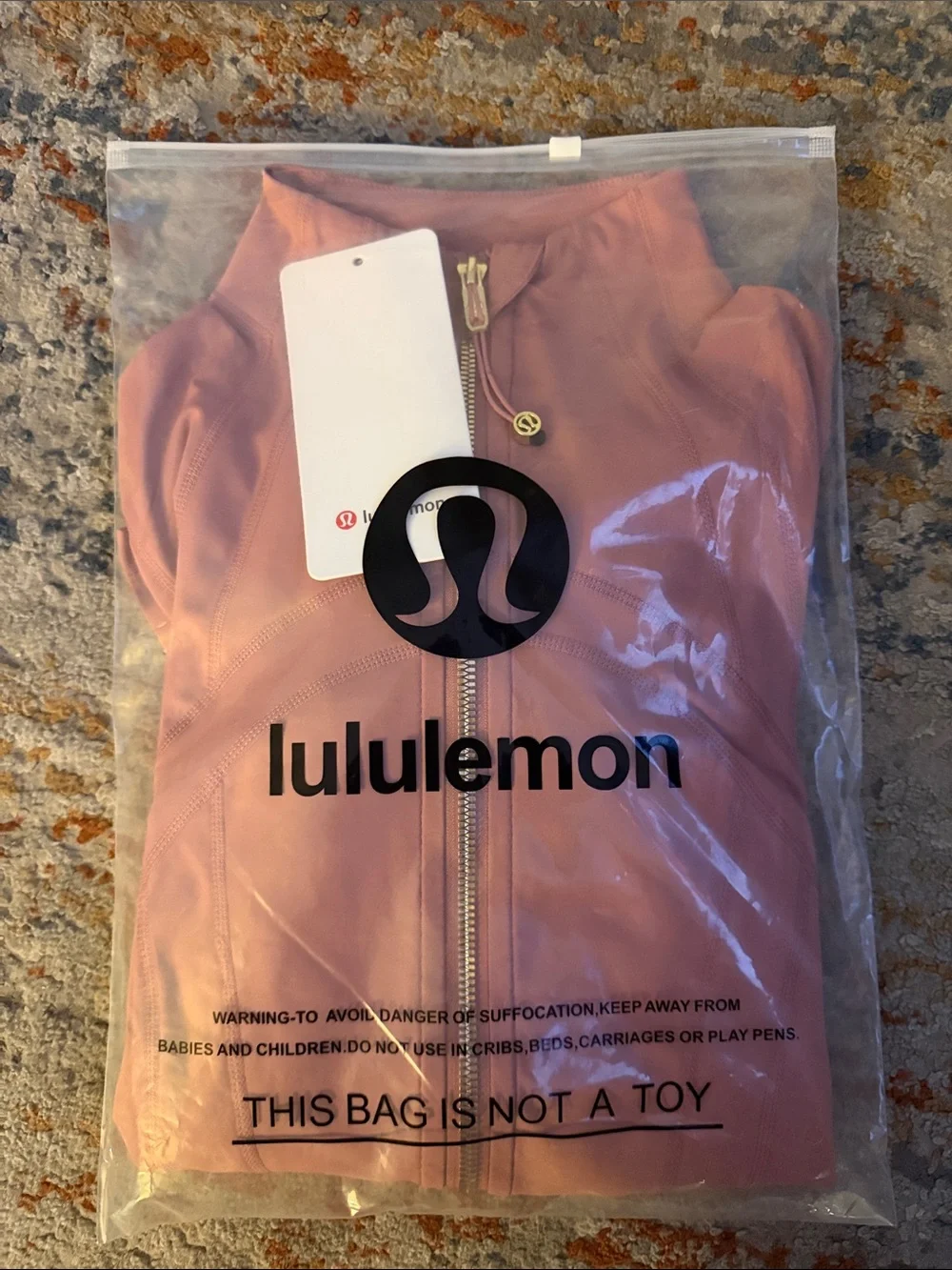 lululemon athletica rose-mauve zip jacket with gold hardware